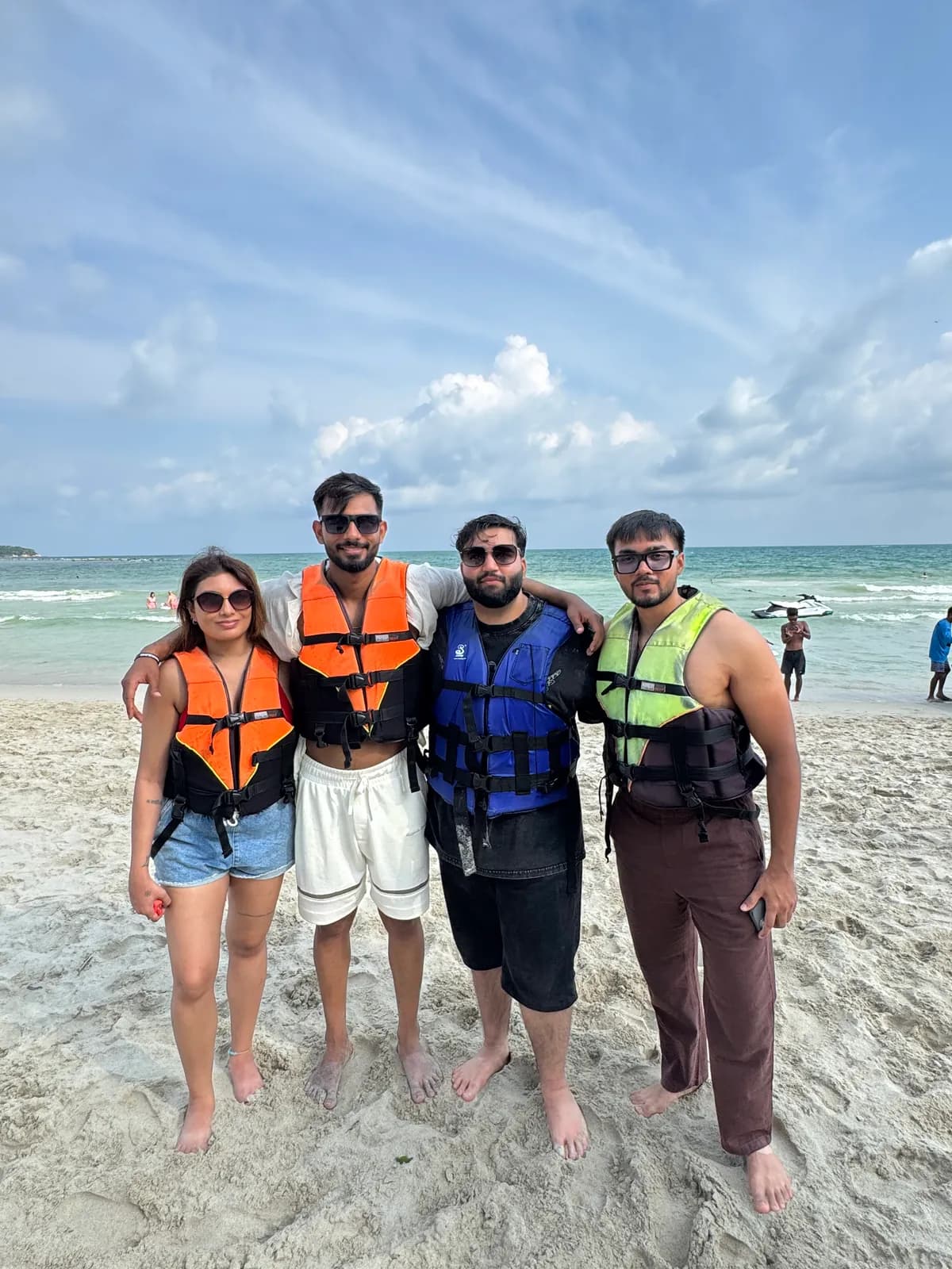 Boketto travellers in life jackets on the beach